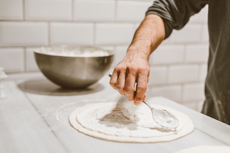 Punch pizza team preparing authentic Neapolitan pizza with care and passion
