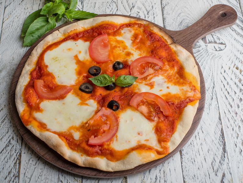Classic Margherita punch pizza with fresh basil